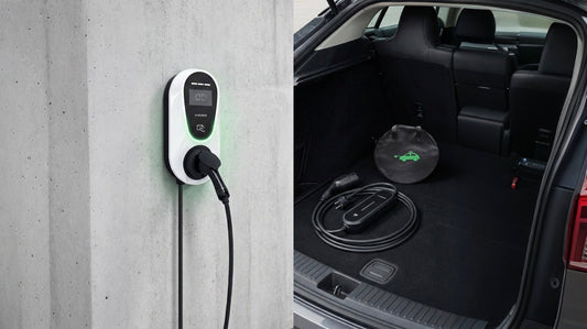 Wall-mounted white electric vehicle charger and portable EV charging cable in car trunk with black interior